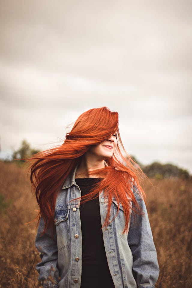 woman getting hair extensions in salon