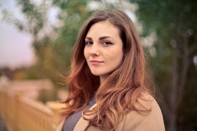 woman in tan jacket